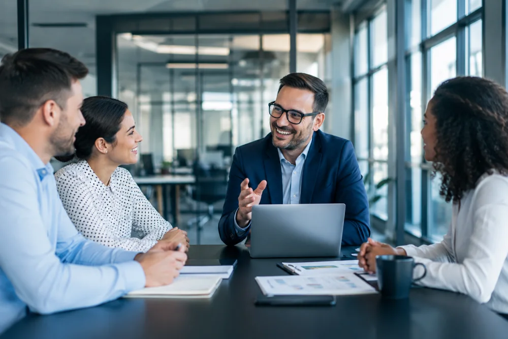 Two professionals discussing leads in an office